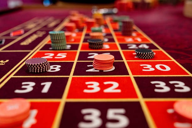betwing platform showing Domino QQ tables alongside Liga 1 sportsbook markets
